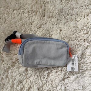 Lululemon Light Gray Mini Everywhere Belt Bag with Neon Orange Accent